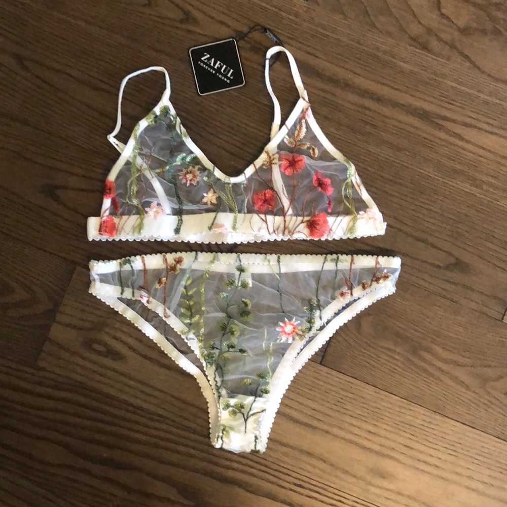 Delicate white mesh two-piece bra and panties with beautiful embroidered flower